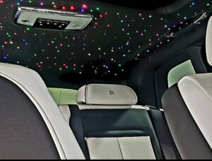 pink and green multi colored led fiber optic star headliner in a luxury car