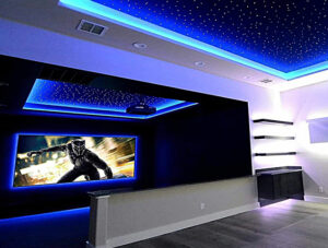 Blue LED perimeter lighting around custom fiber optic star ceiling panels in a home theater room. Ideas for man cave