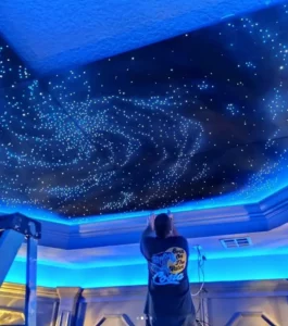 Man installing epixsky custom star ceiling panels