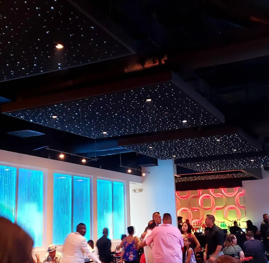 Bar scene with lighted wall in the background and Epixsky star ceiling panels.